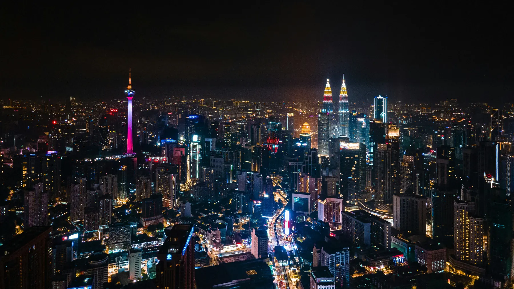 Kuala Lumpur at night with the Petronas Towers and KL Tower lit up